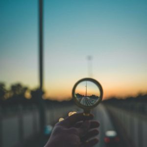 Magnifying glass zooming into the city 